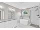 Modern bathroom with soaking tub and glass-enclosed shower at 3327 James Harbor Way, Lawrenceville, GA 30044