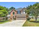 Charming two-story home with an attached two-car garage and well-manicured lawn at 3327 James Harbor Way, Lawrenceville, GA 30044