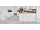 Cozy kitchen with white cabinets, black appliances, and mosaic tile backsplash at 3327 James Harbor Way, Lawrenceville, GA 30044