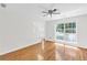 Open-concept living room with new hardwood floors and natural lighting at 3327 James Harbor Way, Lawrenceville, GA 30044