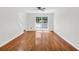 Open living room featuring hardwood floors, and large window at 3327 James Harbor Way, Lawrenceville, GA 30044