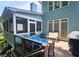 Back deck offers outdoor seating and picturesque views of the surrounding greenery for relaxing at 3740 Ashford Ne Pt, Brookhaven, GA 30319