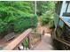 Stairs lead to a serene backyard with lush greenery, offering a peaceful retreat at 3740 Ashford Ne Pt, Brookhaven, GA 30319