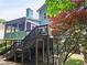 Multi-level deck and lush backyard, perfect for outdoor living and entertaining in a natural setting at 3740 Ashford Ne Pt, Brookhaven, GA 30319