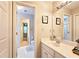 Bathroom featuring a white sink and mirror, and a tiled floor at 3740 Ashford Ne Pt, Brookhaven, GA 30319