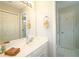 Bathroom featuring a white vanity, a towel warmer, and two doors at 3740 Ashford Ne Pt, Brookhaven, GA 30319