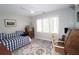 Bright bedroom with a daybed, ample natural light, and a ceiling fan at 3740 Ashford Ne Pt, Brookhaven, GA 30319