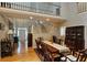 Bright dining room with hardwood floors and stairs leading to the upper level, flooded with natural light at 3740 Ashford Ne Pt, Brookhaven, GA 30319