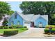 Charming two-story home with a well-maintained lawn and manicured shrubbery at 3740 Ashford Ne Pt, Brookhaven, GA 30319