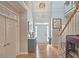 Spacious foyer featuring hardwood floors, a staircase, and a tall door framed by sidelight windows at 3740 Ashford Ne Pt, Brookhaven, GA 30319