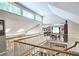 Hallway with a view of the lower level, featuring a staircase with white railing at 3740 Ashford Ne Pt, Brookhaven, GA 30319