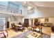 Spacious open-concept living area with a lofted upper level, hardwood floors, and comfortable furniture at 3740 Ashford Ne Pt, Brookhaven, GA 30319