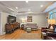 Cozy den area with modern lighting, hardwood floors, and neutral wall paint at 3740 Ashford Ne Pt, Brookhaven, GA 30319
