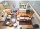 Open living and dining area featuring hardwood floors, built-in cabinets, and natural light at 3740 Ashford Ne Pt, Brookhaven, GA 30319
