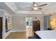 Bright primary bedroom with tray ceiling, hardwood floors, and ample closet space at 3740 Ashford Ne Pt, Brookhaven, GA 30319
