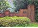 Charming Ashford Manor brick community sign surrounded by manicured greenery at 3740 Ashford Ne Pt, Brookhaven, GA 30319