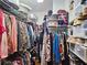 Organized walk-in closet with ample storage and shelving for clothes and accessories at 3740 Ashford Ne Pt, Brookhaven, GA 30319