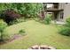Lush backyard with mature trees and landscaping, ideal for outdoor enjoyment at 4020 Alligator Pt, Cumming, GA 30028