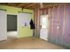 Unfinished basement area with exterior door, ready for customization and expansion at 4020 Alligator Pt, Cumming, GA 30028