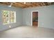 Spacious unfinished basement with bright window offers potential for a variety of uses at 4020 Alligator Pt, Cumming, GA 30028