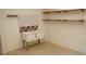Basement includes double wash tubs, peg board, shelving, tile backsplash, and a concrete floor at 4020 Alligator Pt, Cumming, GA 30028