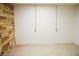 Spacious basement featuring wood walls and doorway to unfinished space at 4020 Alligator Pt, Cumming, GA 30028