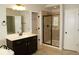 Bathroom showcasing a shower, bathtub and a door to another room at 4020 Alligator Pt, Cumming, GA 30028