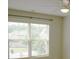 Bright bedroom featuring a large window with natural light and a ceiling fan at 4020 Alligator Pt, Cumming, GA 30028