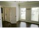 Bright and airy room with hardwood floors, large windows, and an adjoining room at 4020 Alligator Pt, Cumming, GA 30028