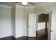 Bright bedroom with crown molding, hardwood floors, and access to another room at 4020 Alligator Pt, Cumming, GA 30028