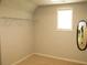 Bright closet with a clothing rack, a mirror, and a neutral wall at 4020 Alligator Pt, Cumming, GA 30028