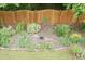 Elevated view of a well-maintained garden with vibrant foliage and a wooden fence at 4020 Alligator Pt, Cumming, GA 30028