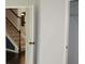 View of the staircase with dark handrail and access to a walk-in closet at 4020 Alligator Pt, Cumming, GA 30028