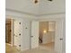 Bright open hallway leading to a bathroom and other rooms at 4020 Alligator Pt, Cumming, GA 30028