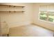 An unfinished laundry room with white walls and concrete flooring at 4020 Alligator Pt, Cumming, GA 30028