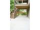 Spacious patio area with overhead deck, perfect for outdoor entertaining and relaxation at 4020 Alligator Pt, Cumming, GA 30028