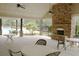 Covered patio with a stone fireplace and view of the pool at 4020 Alligator Pt, Cumming, GA 30028