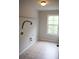 Room featuring a window and a light fixture at 4020 Alligator Pt, Cumming, GA 30028