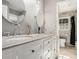 Bright bathroom features double sinks, granite countertops and elegant fixtures at 4384 Herschel Rd, College Park, GA 30337