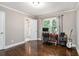 Bedroom with hardwood floors, natural light, and an attached bathroom at 4384 Herschel Rd, College Park, GA 30337