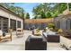 Backyard patio setup perfect for entertaining guests with multiple seating and dining areas at 591 E Morningside Ne Dr, Atlanta, GA 30324