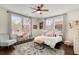 Bright bedroom with ample natural light, a decorative rug, and a cozy seating area, offering a comfortable space at 591 E Morningside Ne Dr, Atlanta, GA 30324