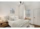 Bright bedroom with white walls, a comfy bed, and a window seat, creating a cozy and inviting space at 591 E Morningside Ne Dr, Atlanta, GA 30324