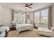 Inviting bedroom featuring bright windows, neutral-toned walls and decor, with warm-colored hardwood floors at 591 E Morningside Ne Dr, Atlanta, GA 30324