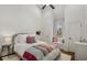 Cozy bedroom with vaulted ceiling, a comfortable bed, and a charming window seat at 591 E Morningside Ne Dr, Atlanta, GA 30324
