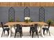 Charming outdoor dining area featuring a wooden table, black metal chairs, and decorative trellis at 591 E Morningside Ne Dr, Atlanta, GA 30324