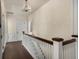 Hallway with hardwood floors, a staircase with white railing, and a view to the landing at 591 E Morningside Ne Dr, Atlanta, GA 30324