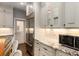 Kitchen showcasing stainless steel appliances, white cabinetry, and stylish counter tops at 591 E Morningside Ne Dr, Atlanta, GA 30324