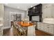 Bright kitchen with a large island, stylish seating, and an open view to the dining area at 591 E Morningside Ne Dr, Atlanta, GA 30324