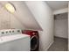 Basement laundry room area features a red dryer and white washing machine at 591 E Morningside Ne Dr, Atlanta, GA 30324